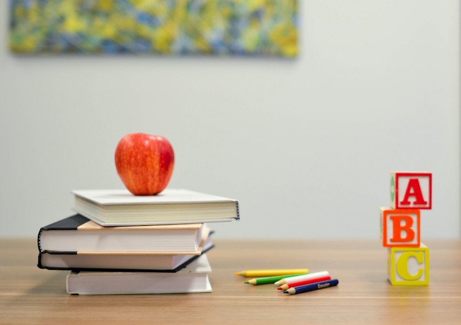 Stack of school books with an apple